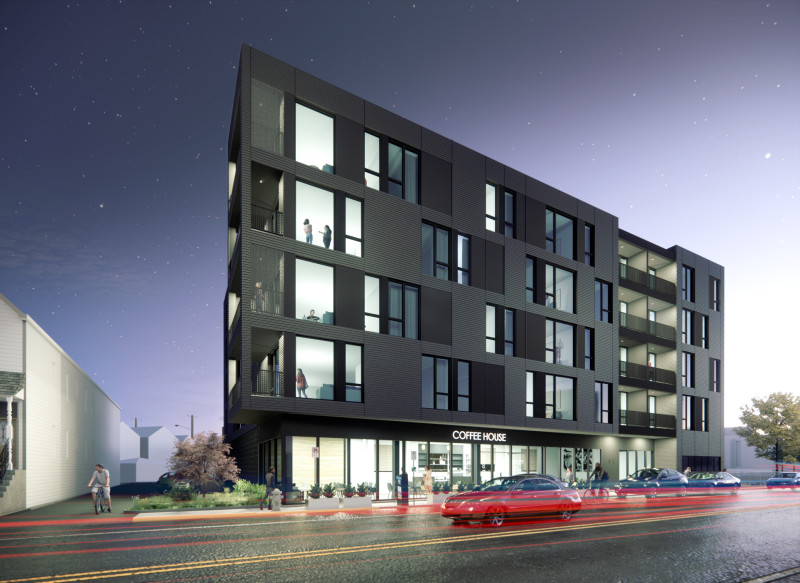 A rendering of a dark gray apartment building at night. Many of the windows are illuminated, and the lights of cars blur by on the street in front. 